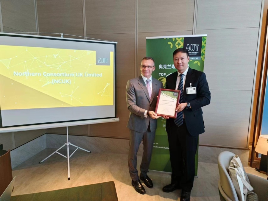 Harry Feng posing for a photograph with Professor Guy Littlefair